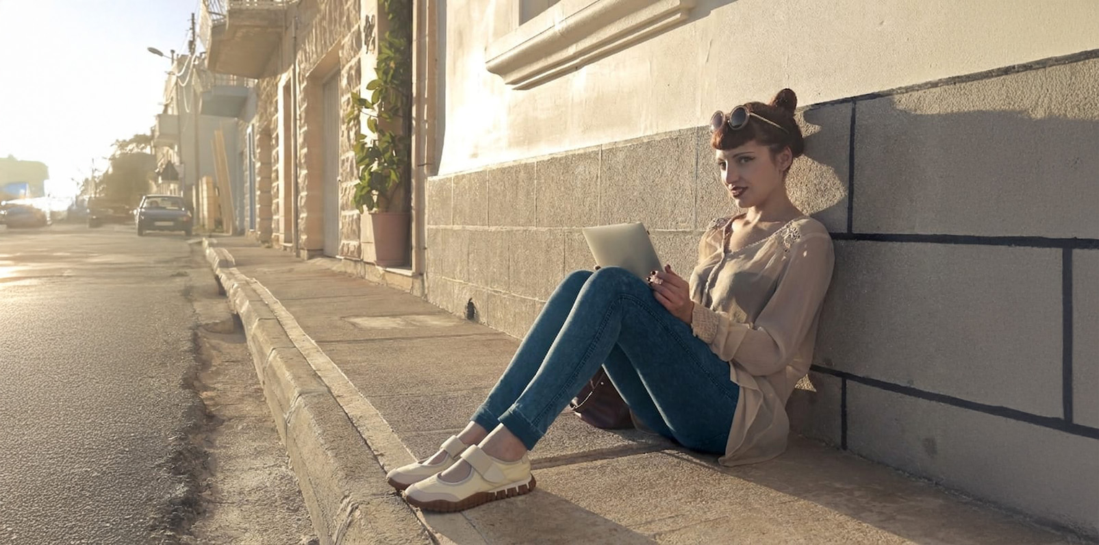 Woman wearing casual shoes on a sunny city street