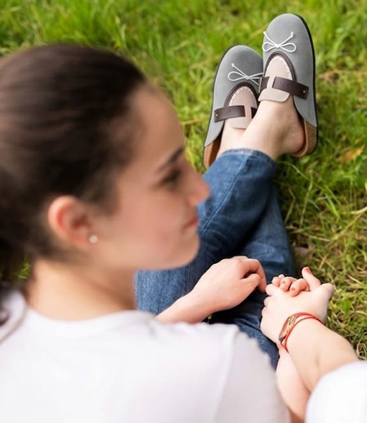 Grey flats styled casually on grass